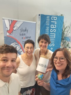 The International Office team smiles at the camera.